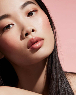 Cheeks Out Freestyle Cream Blush light model shown in shade Petal Poppin