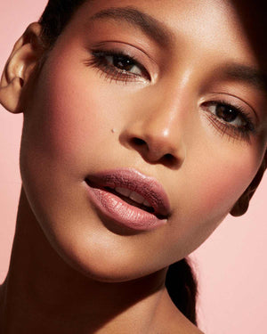 Cheeks Out Freestyle Cream Blush tan model shown in shade Petal Poppin