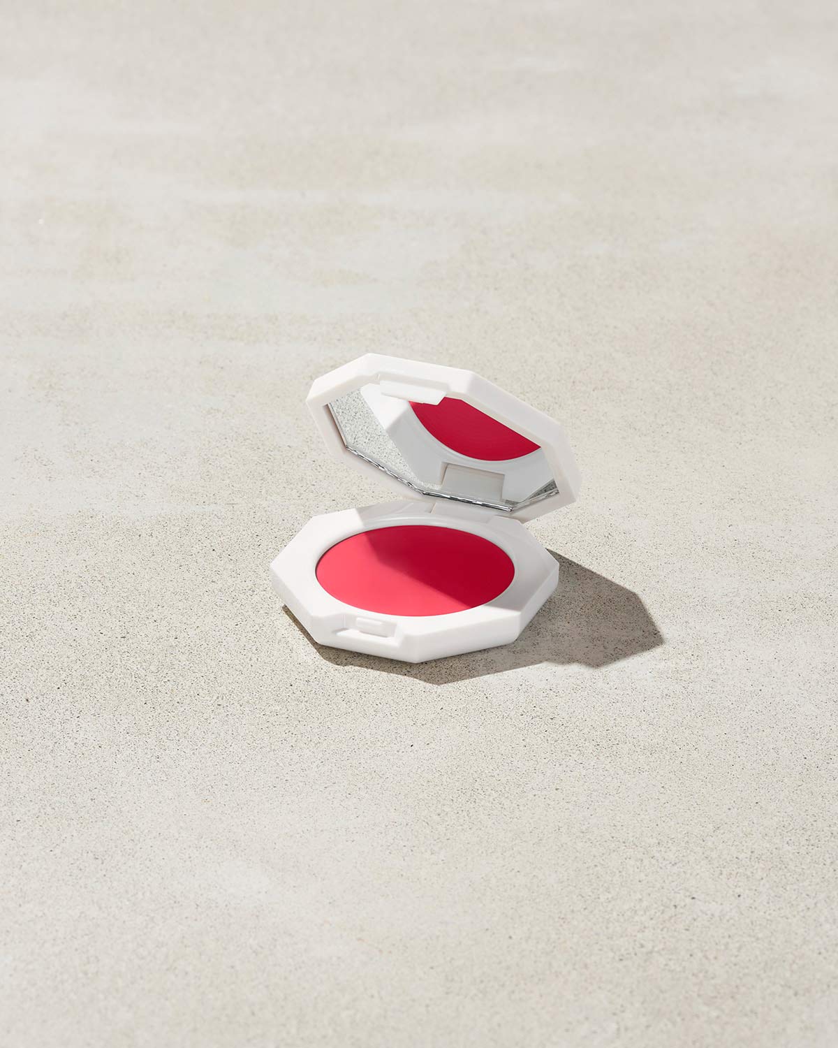 Cheeks Out Freestyle Cream Blush shown in shade Strawberry Drip