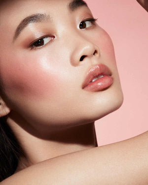 Cheeks Out Freestyle Cream Blush light model shown in shade Strawberry Drip