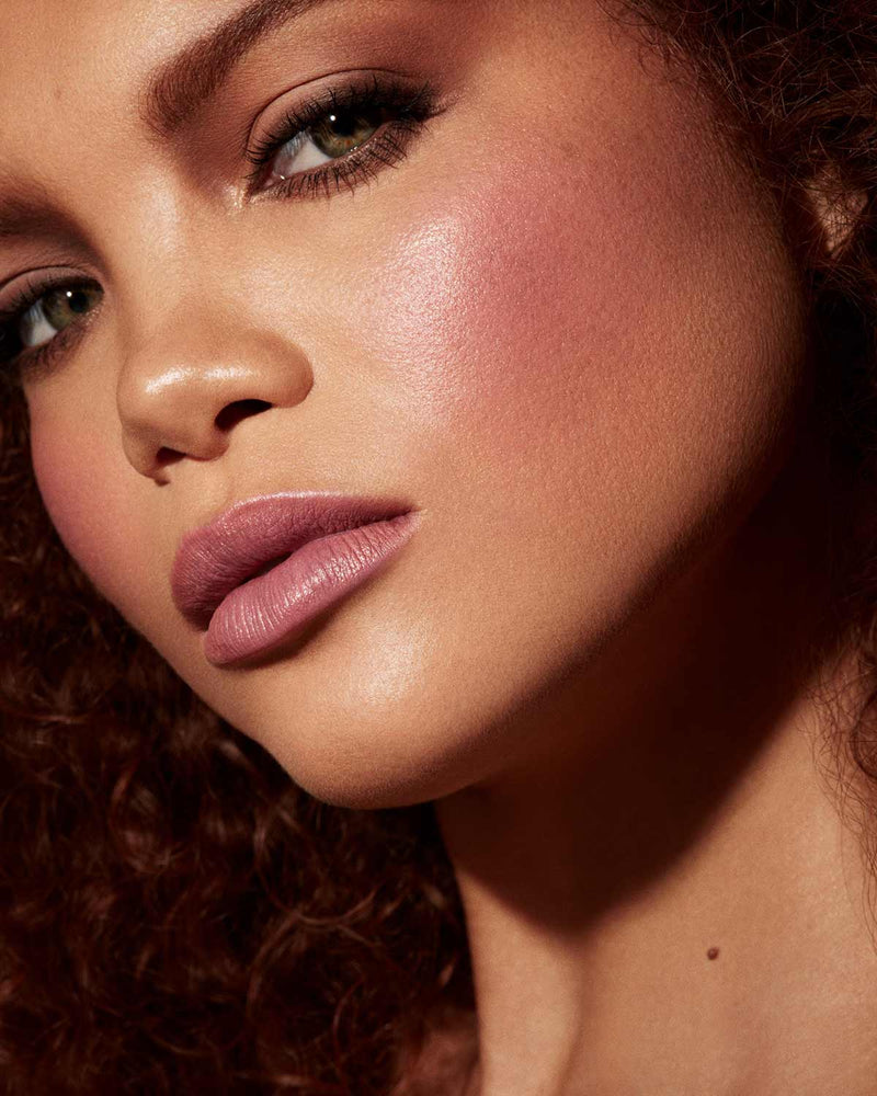 Cheeks Out Freestyle Cream Blush tan model shown in shade Drama Cla$$