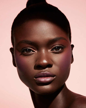 Cheeks Out Freestyle Cream Blush deep model shown in shade Drama Cla$$