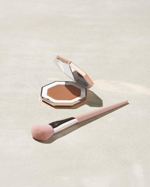 Cheeks Out Freestyle Cream Bronzer shown in shade Macchiato with Face Shaping Brush 125