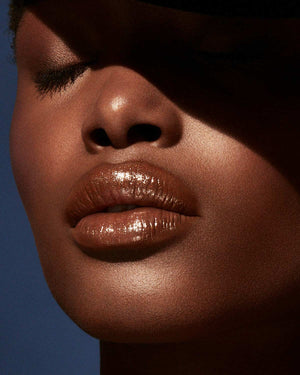 Slip Shine Sheer Shiny Lipstick deep model shown in shade Bubblerum