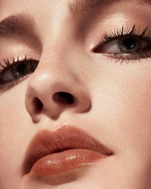 Slip Shine Sheer Shiny Lipstick light model shown in shade Bubblerum
