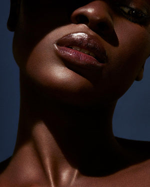 Slip Shine Sheer Shiny Lipstick deep model shown in shade Vamps Who Brunch