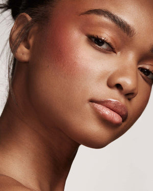 model imagery of killawatt in shade ruby riches on medium skin tone