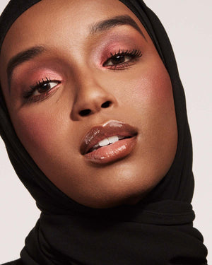 model imagery of killawatt in shade ruby riches on medium deep skin tone