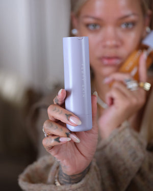 Rihanna holding Hydra Vizor Mineral SPF Moisturiser