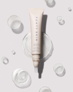 Open tube of Blemish Defeat'r BHA Spot-Targeting Gel against a light backdrop surrounded by drops of the product. Open tube of Blemish Defeat'r BHA Spot-Targeting Gel against a light backdrop surrounded by drops of the product.