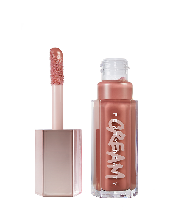 tube of Fenty Beauty Gloss Bomb Cream Color Drip Lip Cream lip gloss shown in shade Fenty Glow tube of Fenty Beauty Gloss Bomb Cream Color Drip Lip Cream lip gloss shown in shade Fenty Glow