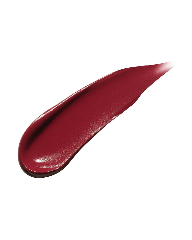 Smear showing the texture of high-pigment Fenty Icon matte lipstick in the burgundy red shade, Board Memb'r.