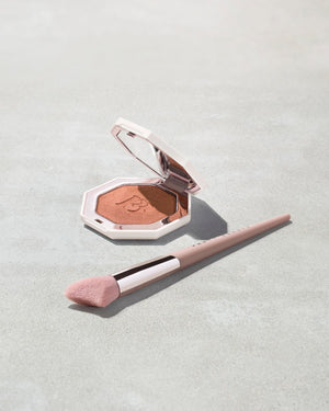 Killawatt Foil Freestyle Highlighter shown in shade Penny 4UThots with Cheek Hugging Highlight Brush