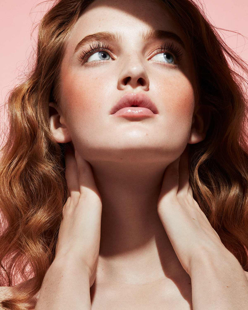 Cheeks Out Freestyle Cream Blush light model shown in shade Fuego Flush