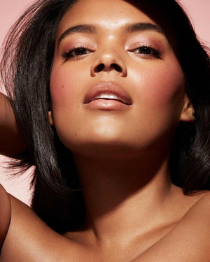 Cheeks Out Freestyle Cream Blush tan model shown in shade Petal Poppin