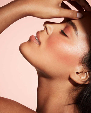 Cheeks Out Freestyle Cream Blush tan model shown in shade Daiquiri Dip