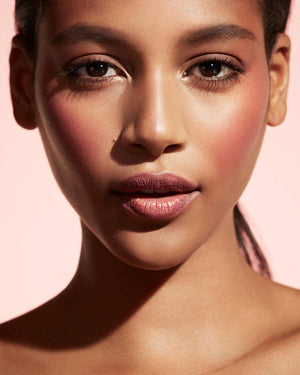 Cheeks Out Freestyle Cream Blush tan model shown in shade Summertime Wine