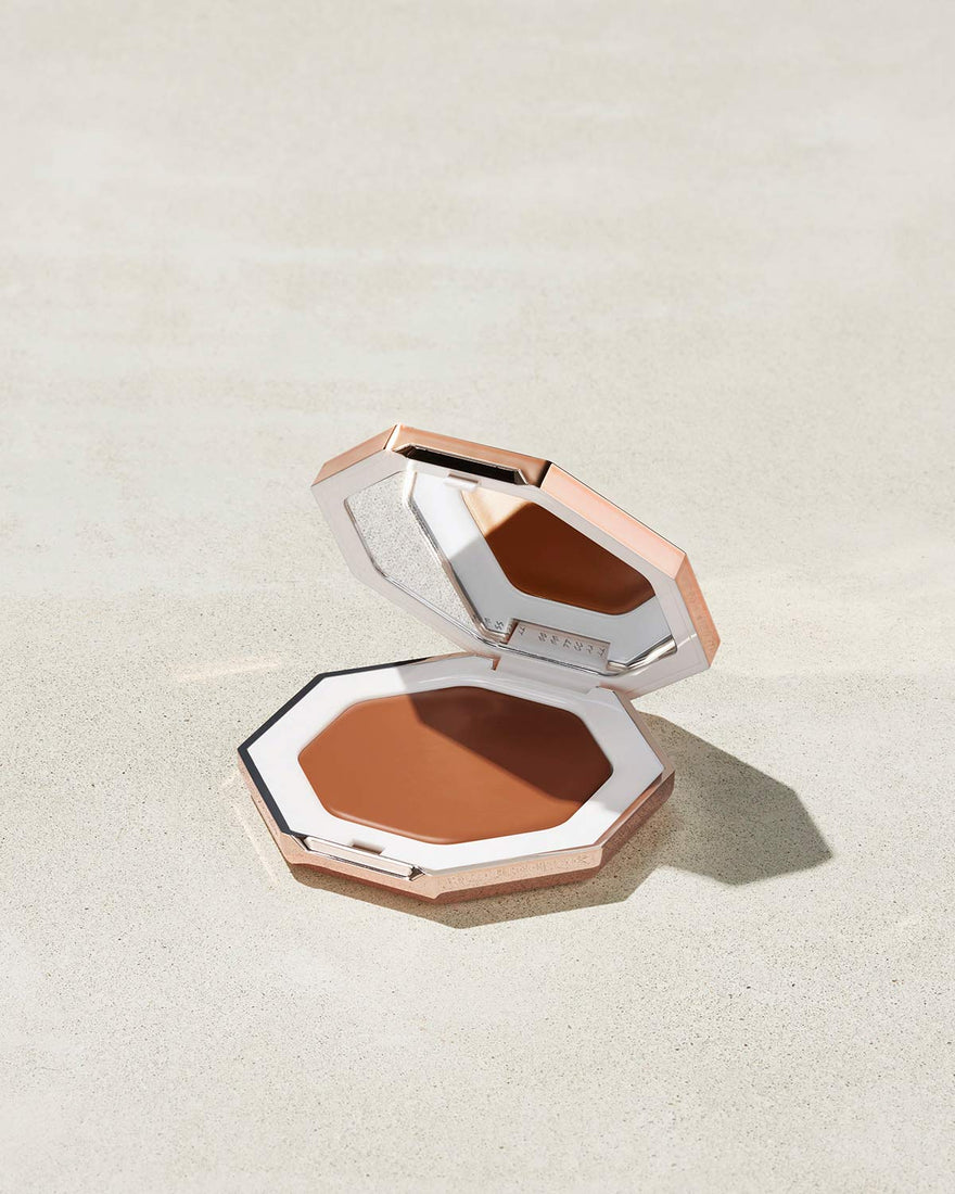 Cheeks Out Freestyle Cream Bronzer shown in shade Hunnie Glaze