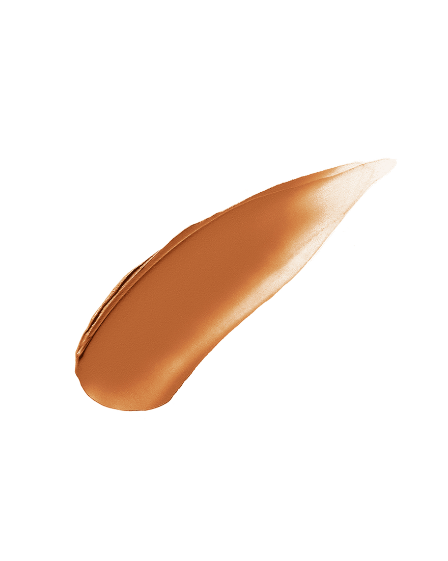 Cheeks Out Freestyle Cream Bronzer smear shown in shade Hunnie Glaze