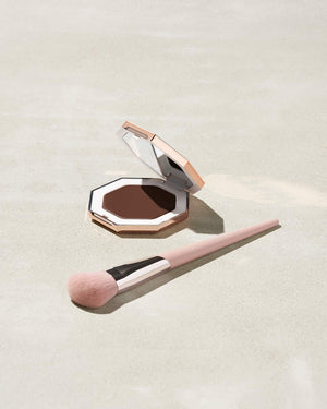 Cheeks Out Freestyle Cream Bronzer shown in shade Chocolate with Face Shaping Brush 125