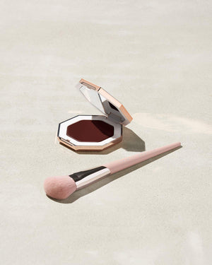 Cheeks Out Freestyle Cream Bronzer shown in shade Toffee Tease with Face Shaping Brush 125