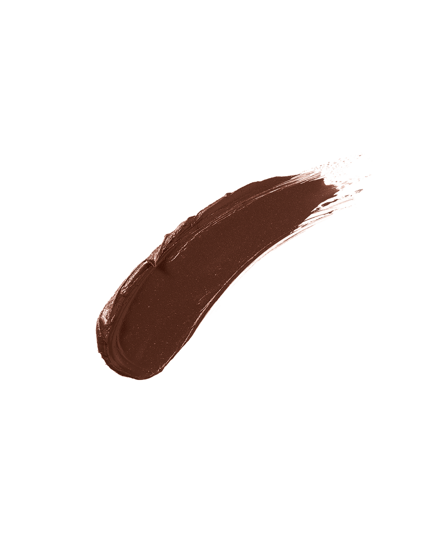 A smear of Match Stix Contour Skinstick in the shade Ebony on a white background.