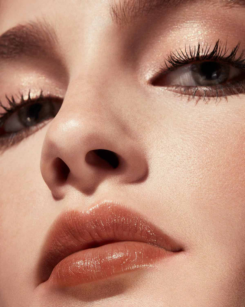 Slip Shine Sheer Shiny Lipstick light model shown in shade Bubblerum