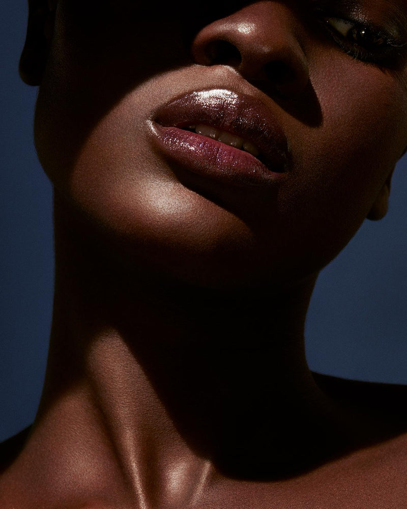 Slip Shine Sheer Shiny Lipstick deep model shown in shade Vamps Who Brunch