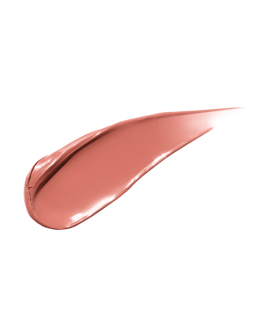 smear of Fenty Beauty Gloss Bomb Cream Color Drip Lip Cream lip gloss shown in shade Fenty Glow