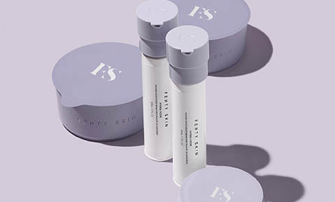 Bottles of refillable face moisturizer and body lotion.