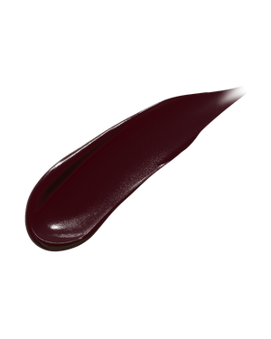 Smear showing the texture of high-pigment Fenty Icon Semi-Matte Refillable Lipstick in the deep burgundy shade, Rowdy Roadie.