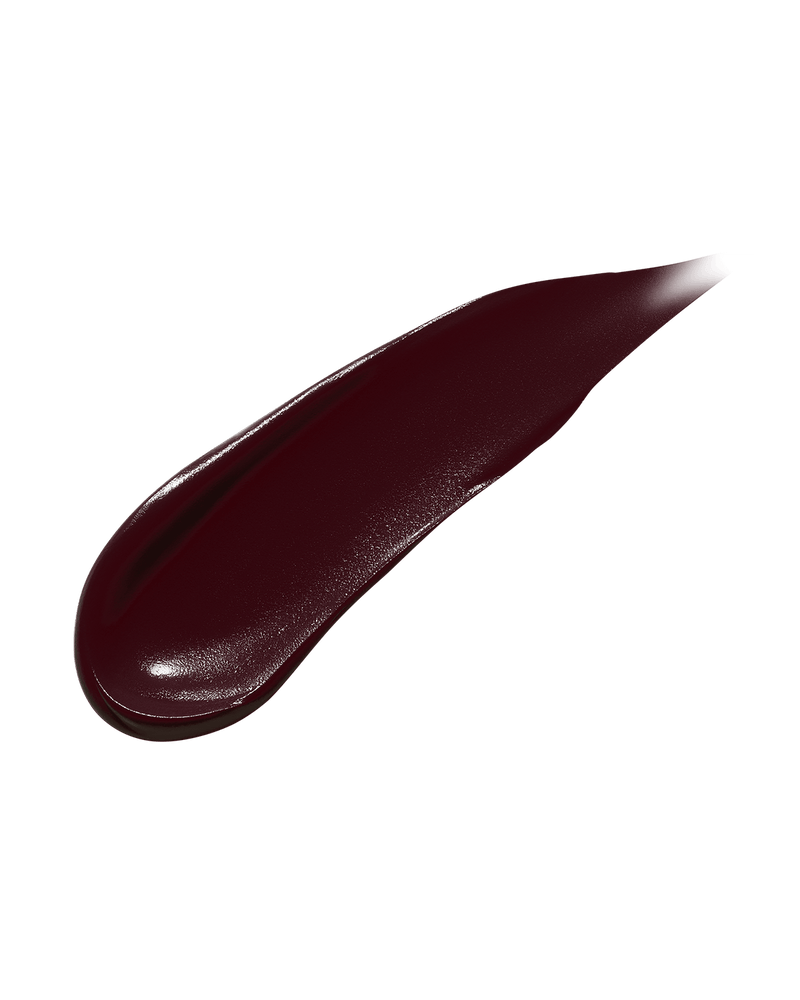 Smear showing the texture of high-pigment Fenty Icon Semi-Matte Refillable Lipstick in the deep burgundy shade, Rowdy Roadie.
