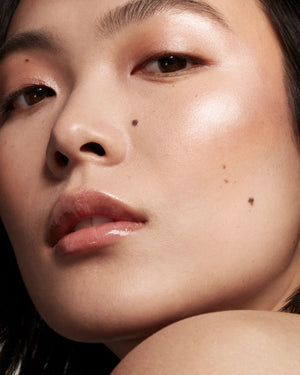 model imagery of killawatt in shades lighting dust and fire crystal on light medium skin tone