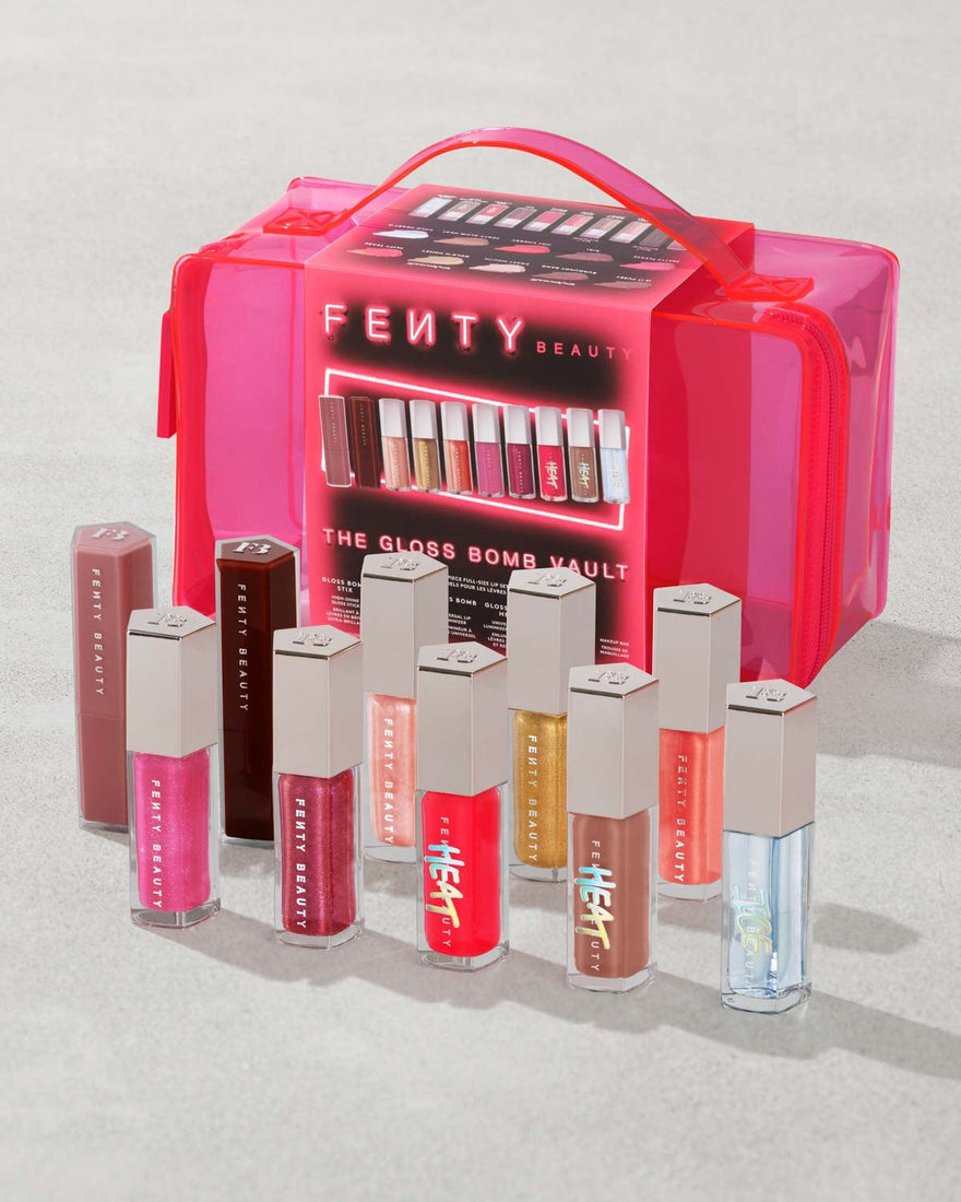 Fenty Beauty gloss products with a pink carrying case on a light gray background