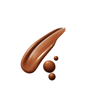 Eaze Drop’Lit All-Over Glow Enhancer smear shown in shade Bronze Jasper. 
