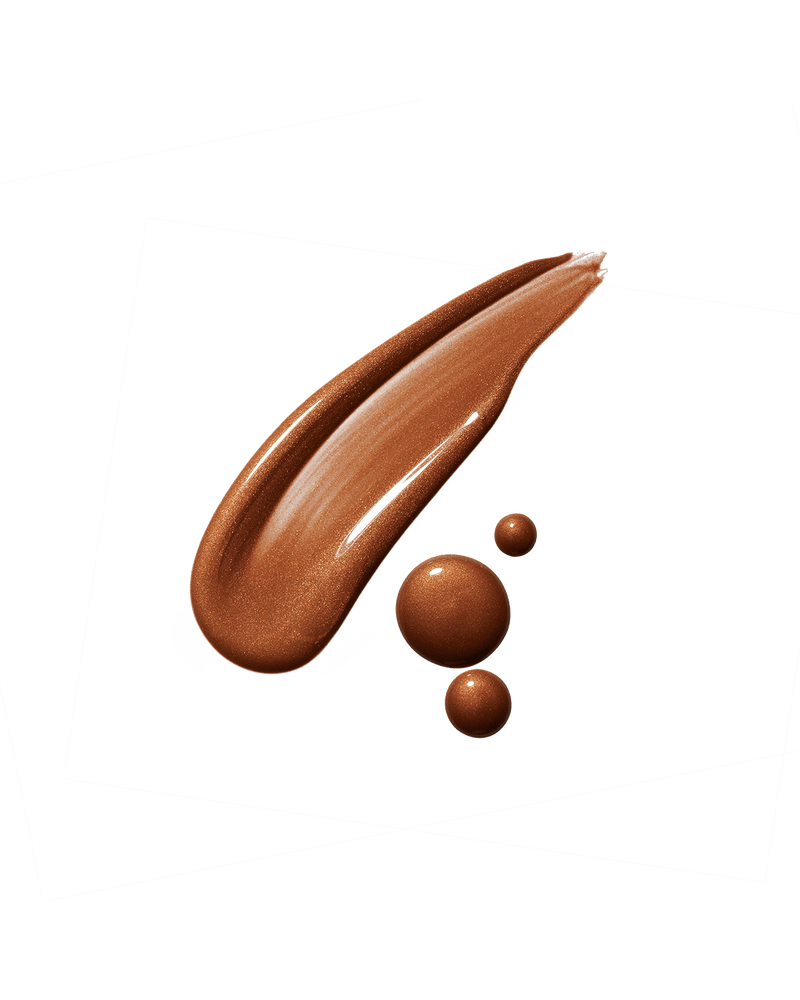 Eaze Drop’Lit All-Over Glow Enhancer smear shown in shade Bronze Jasper. 