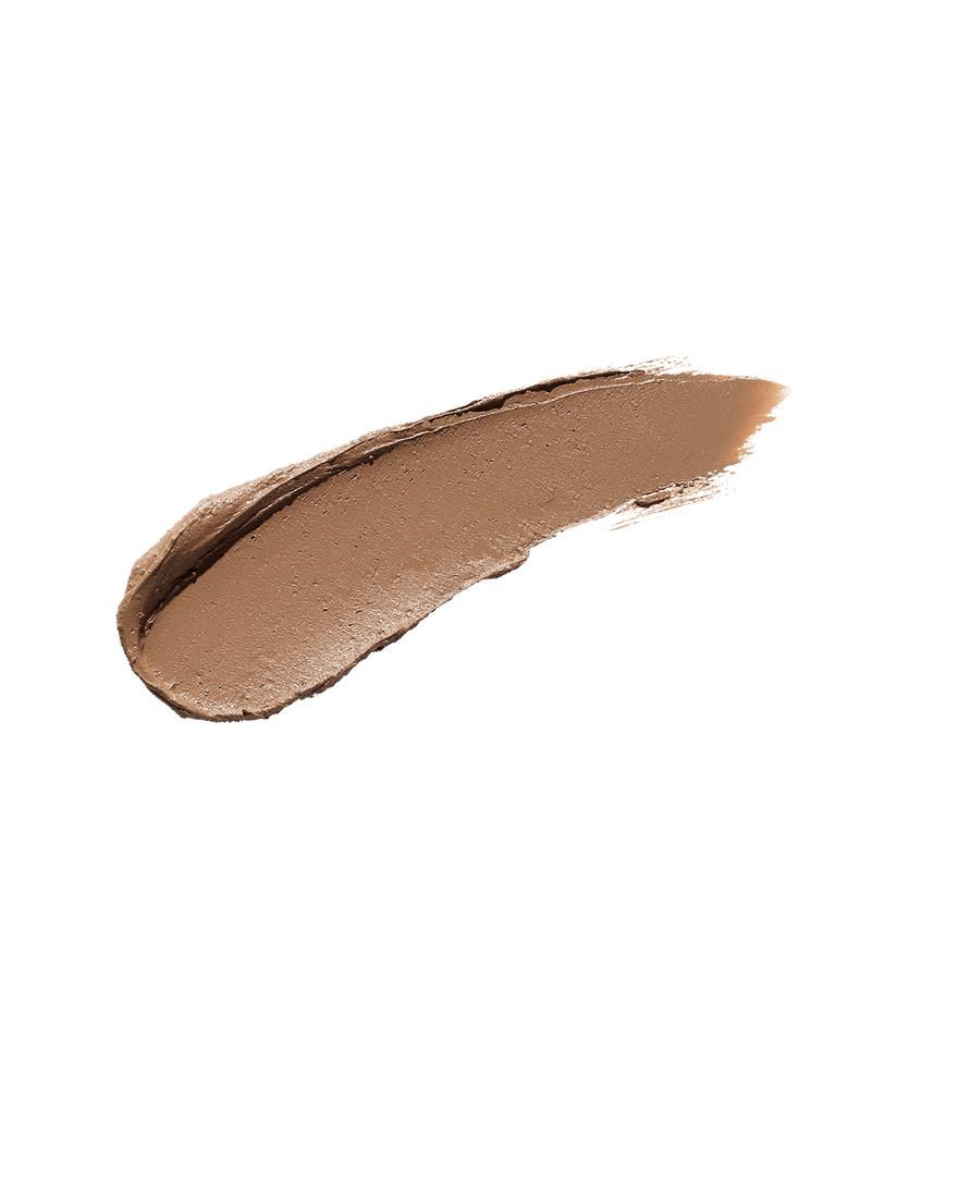 A smear of Match Stix Contour Skinstick in the shade Amber Suede on a white background.