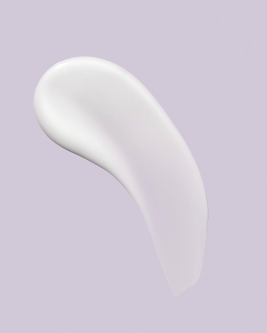 A smear of Watch Ya Tone Niacinamide serum on a lilac background.