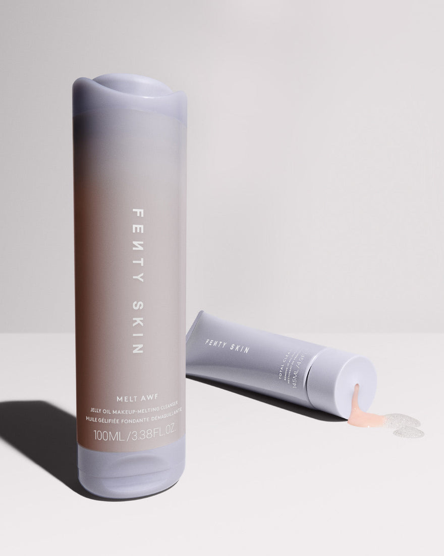 Two cleansers on a light grey background.